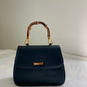 Vintage Susan Gail Navy purse with bamboo handle and shoulder strap.